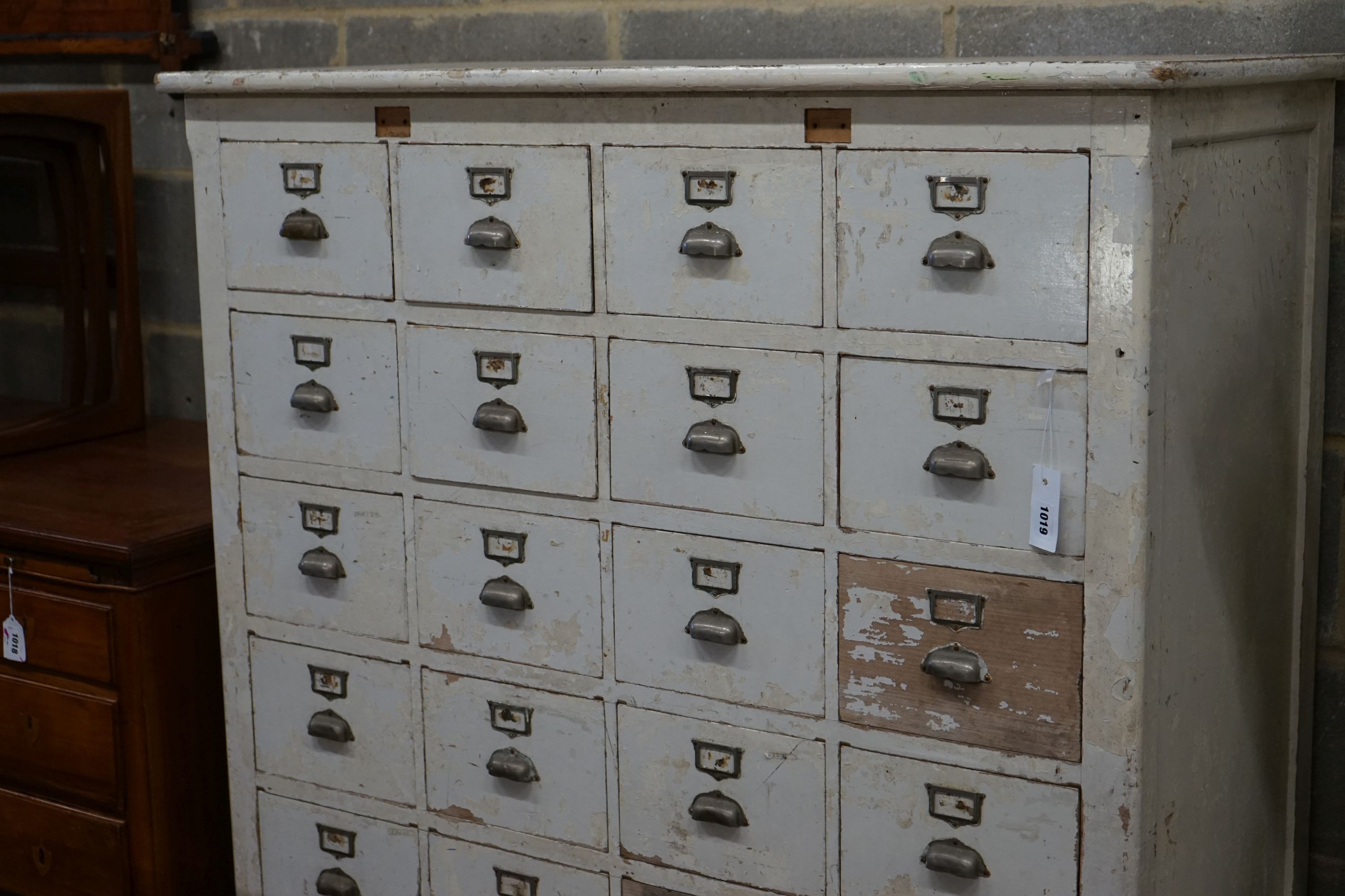 An early 20th century painted beech filing cabinet (lacking two drawers), width 114cm, depth 52cm, height 132cm